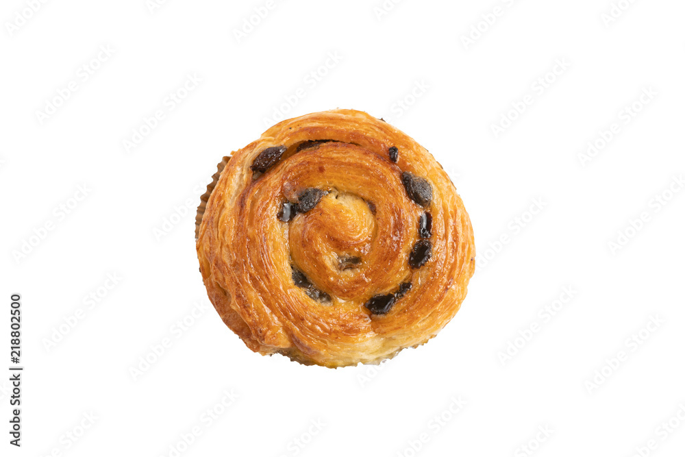 Raisin danish pastry on the yellow wood and blue gingham check cloth isolated on white.