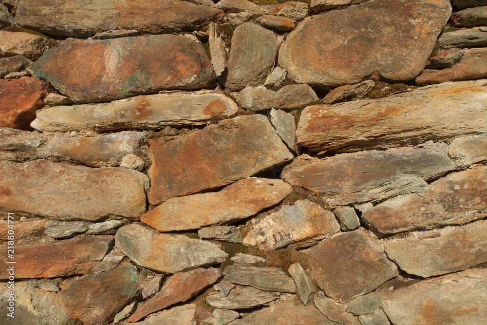 Fototapeta premium a wall built up with stones