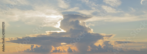 big cloud at sunset and rays of sun