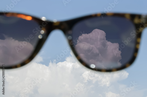 look at the clouds through sunglasses