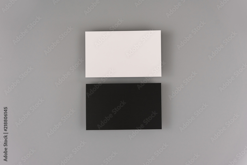 Blank business cards on light background. Mock up for design and branding identity. Blank business cards on light background. Mock up for design and branding identity.