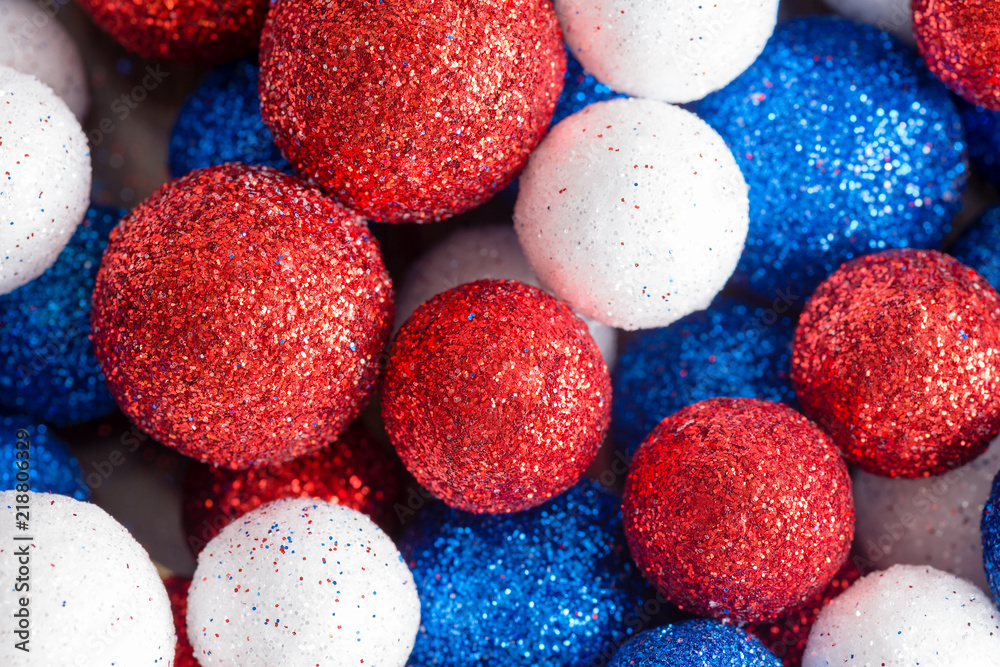 Different sized red white and blue glitter balls Different sized red white and blue glitter balls