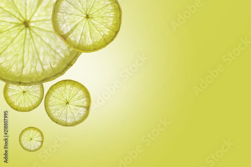 Flat lay Slice of lemon on green background , space for text