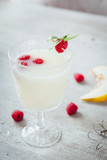 Cocktail of melon with raspberries. Pieces of melon.