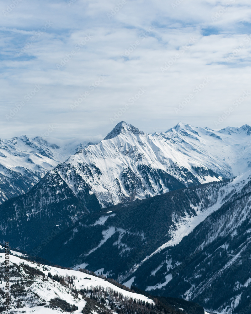 View of a snow covered mountain range and peaks in Mayrhofen, part of the  Austrian Alps whilst on a ski trip in Austria, Europe. 