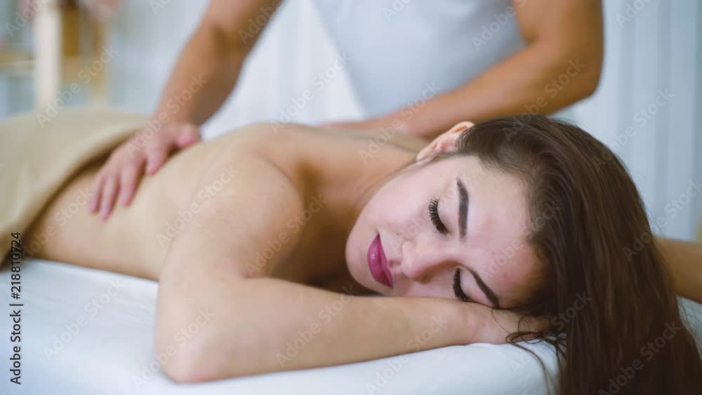 portrait male masseur massaging beautiful woman leg foot in spa salon. Young female enjoying professional treatment. Rehabilitation, medicine, manual therapy, beauty, wellness, healthy concept portrait male masseur massaging beautiful woman leg foot in spa salon. Young female enjoying professional treatment. Rehabilitation, medicine, manual therapy, beauty, wellness, healthy concept