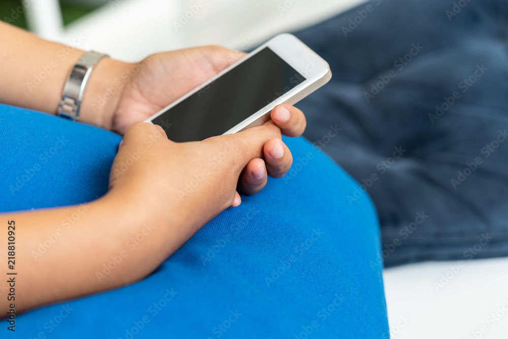 Close up hand holding mobile smart phone with copy space Close up hand holding mobile smart phone with copy space