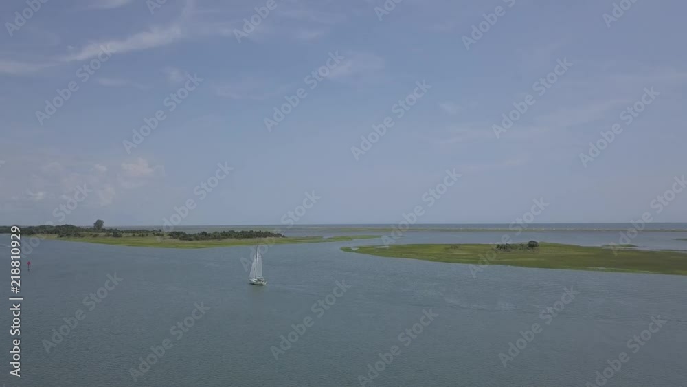 Sail boat and other boats on the intracoastal waterway in North Carolina Sail boat and other boats on the intracoastal waterway in North Carolina