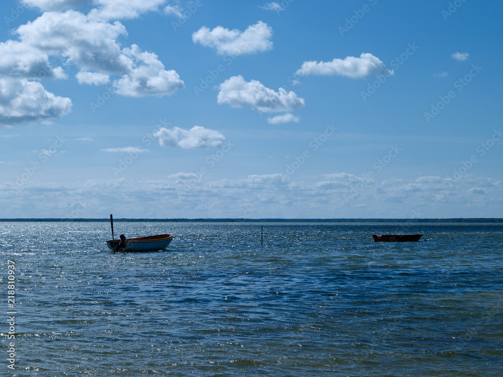 Laesoe / Denmark: Two small fishing boats anchoring in the wide bay at Bloeden Hale Laesoe / Denmark: Two small fishing boats anchoring in the wide bay at Bloeden Hale