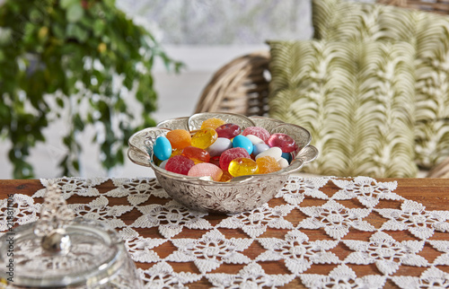 Modern feast and candy plate style on the table and room background chair plant decoration.