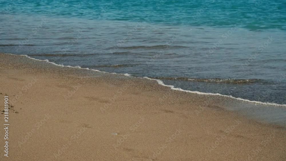 The waves run to the shore. Sand beach. The waves run to the shore. Sand beach.