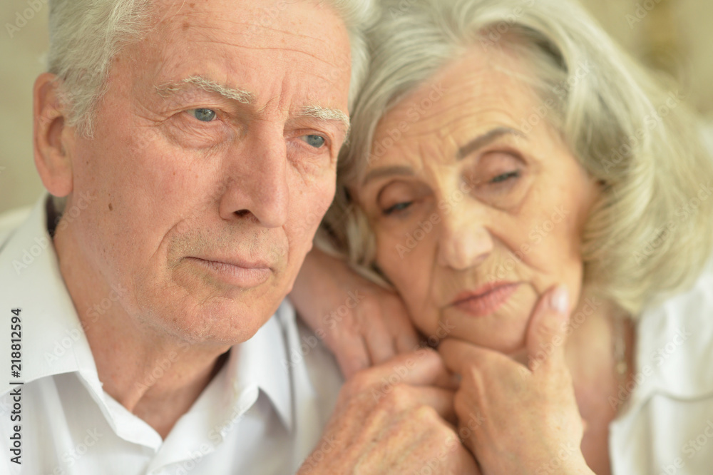 Portrait of a sad senior couple at home Portrait of a sad senior couple at home
