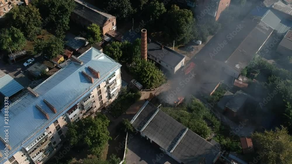 Garage in fire in middle of the city in east Europe sunny weather Garage in fire in middle of the city in east Europe sunny weather