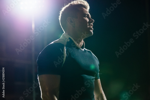 Rugby player on field under lights © Jacob Lund