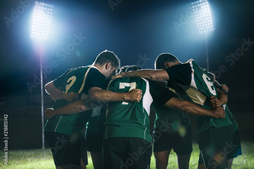 Rugby team in huddle after match