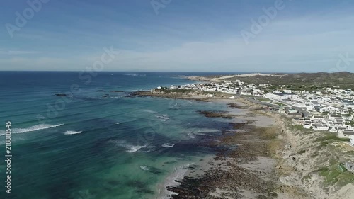 Aerial footage over the small holiday and fishing village of Arniston along the overberg coastline in South Africa
