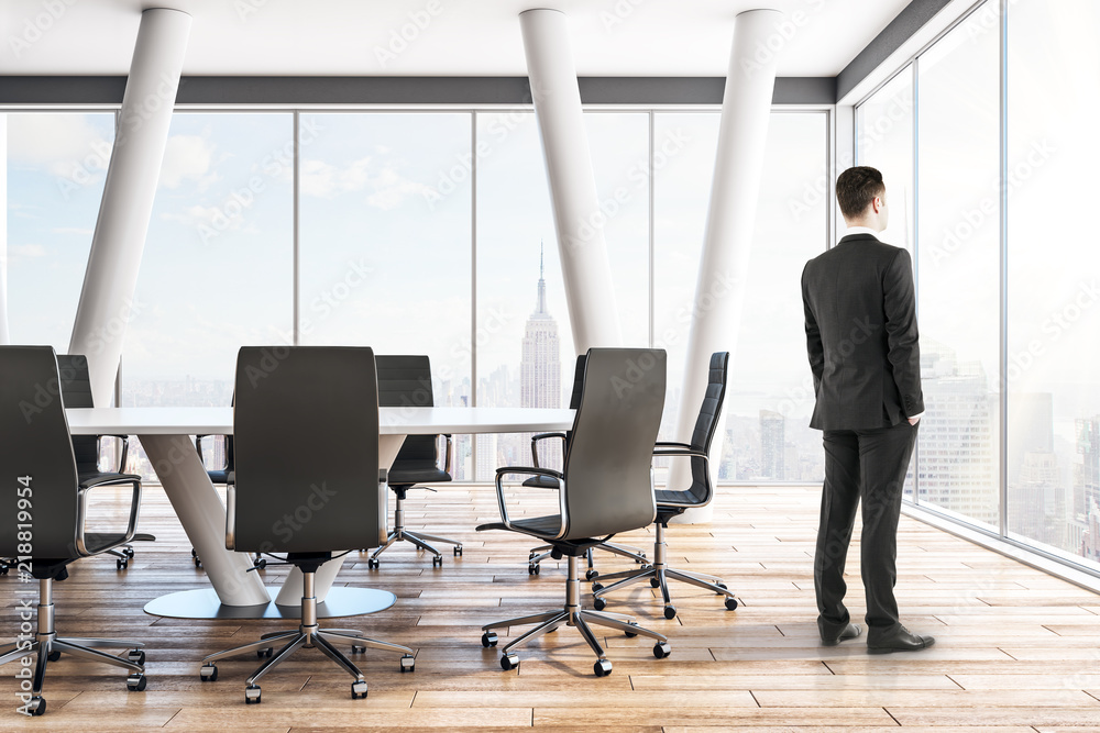 Pensive businessman in meeting room Pensive businessman in meeting room