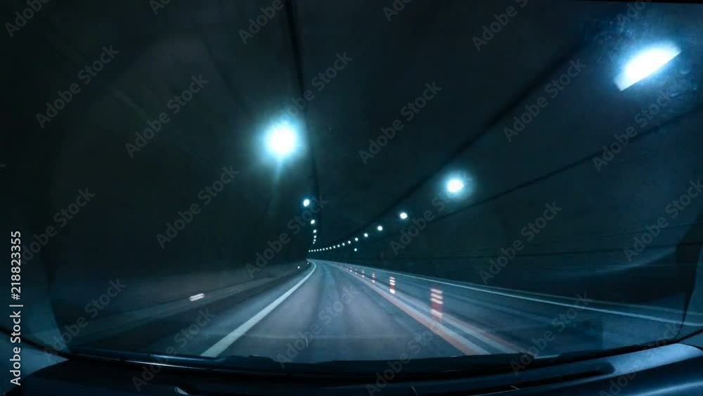 Car POV shot : Blurred motion tunnel. Shot from a slow moving car