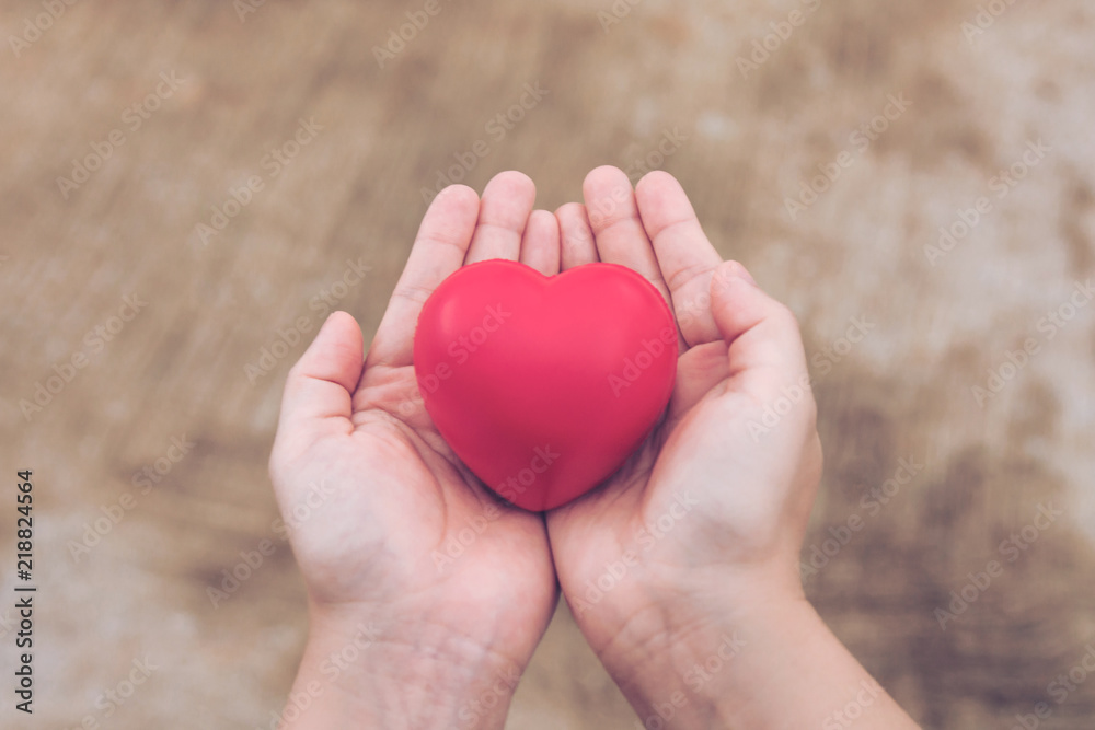 Red heart ball : Stress reliever foam ball the red heart shape on woman hand. Gift valentine's Day Red heart ball : Stress reliever foam ball the red heart shape on woman hand. Gift valentine's Day