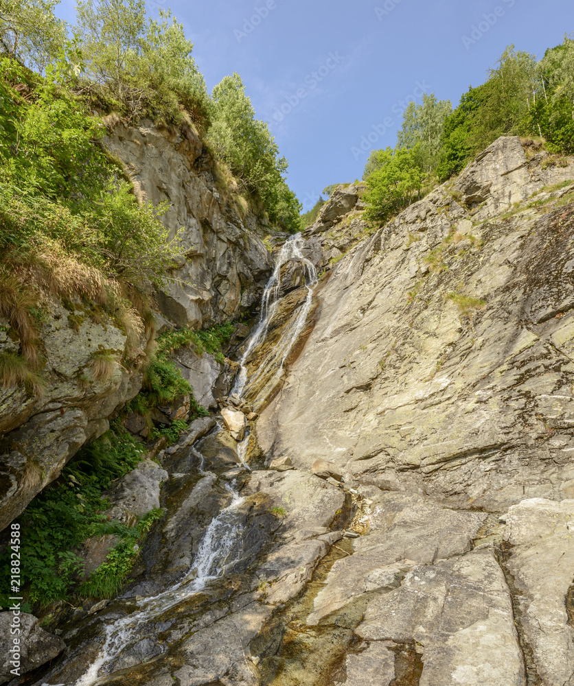 waterfall on rock ravine, Gressoney Saint Jean, Italy