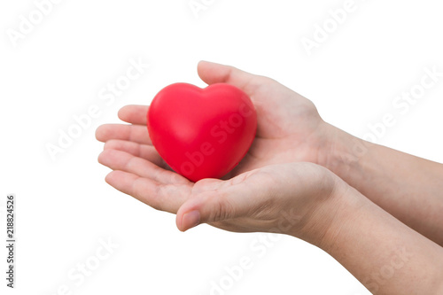 Red heart ball   Stress reliever foam ball the red heart shape on woman hand isolated on white background with clipping path