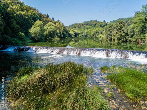 Aerial view from above of stream waterfall on river Dobra, Croatia