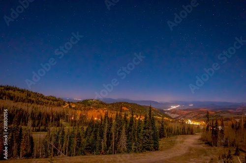Night view of stars over the city in the horizont in Bryce Canyon National Park photo