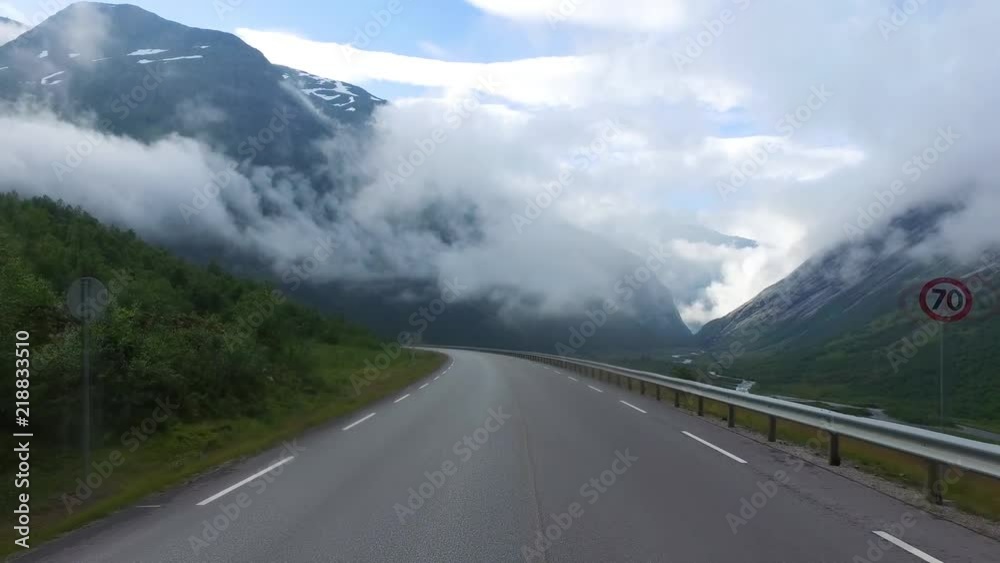 Driving a Car on a Road in Norway Driving a Car on a Road in Norway