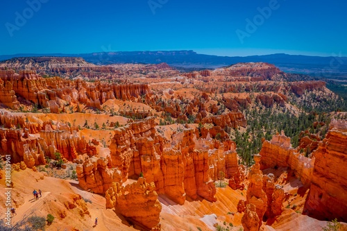 Bryce Canyon National Park landscape, Utah, United States. Nature scene showing beautiful hoodoos, pinnacles and spires rock formations. including Thors Hammer, in a gorgeous blue sky photo