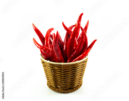 Red chilli pepper in wooden isolated on white background