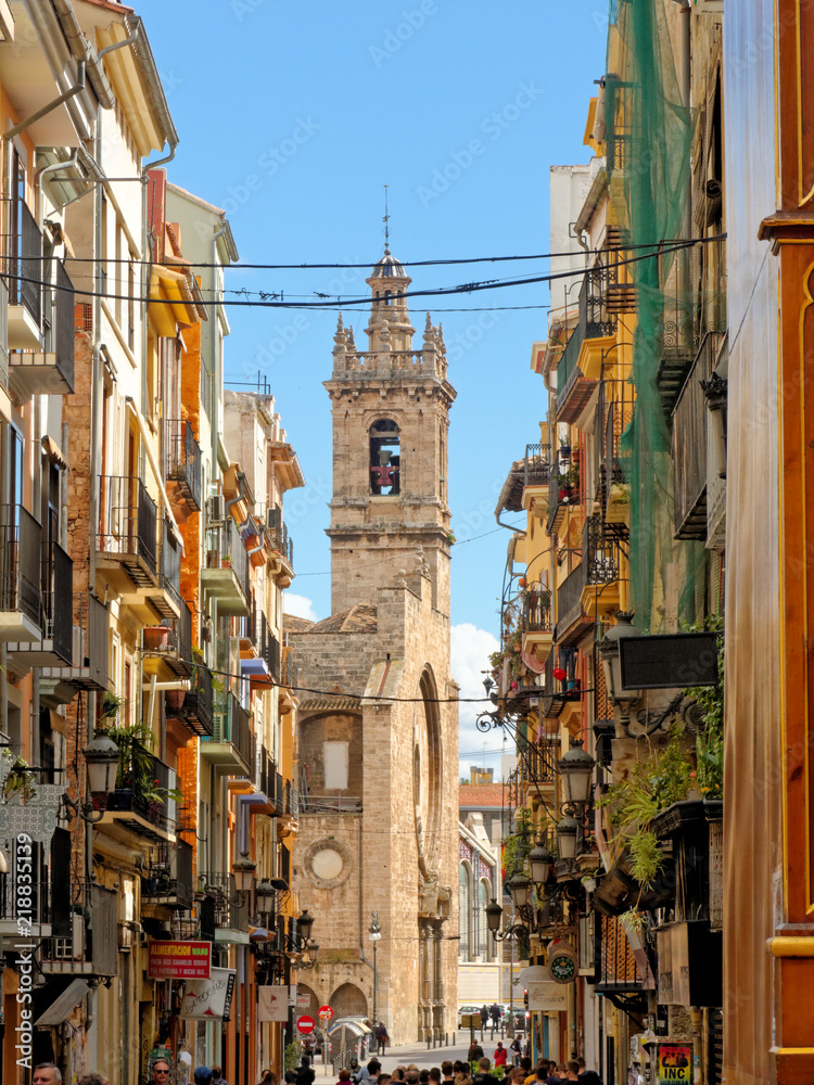 VALENCIA, APRIL 08: A narrow alley full of balconies leading to the church of Sant Joan del Mercat in Valencia. SPAIN 2018.