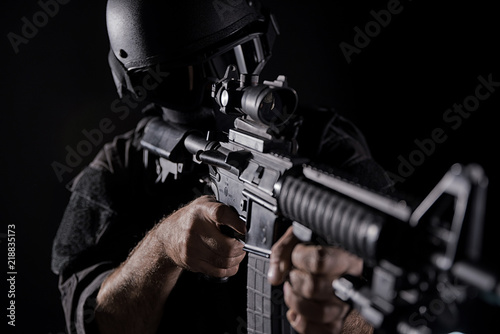 Spec ops police officer SWAT in black uniform