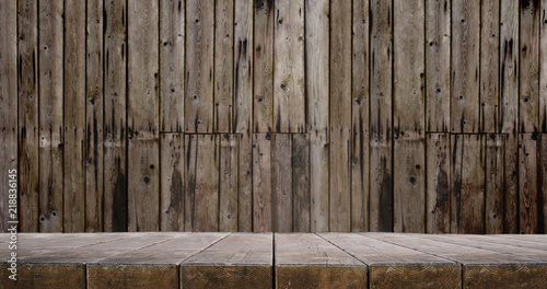 Wooden table and slightly blurred wooden wall