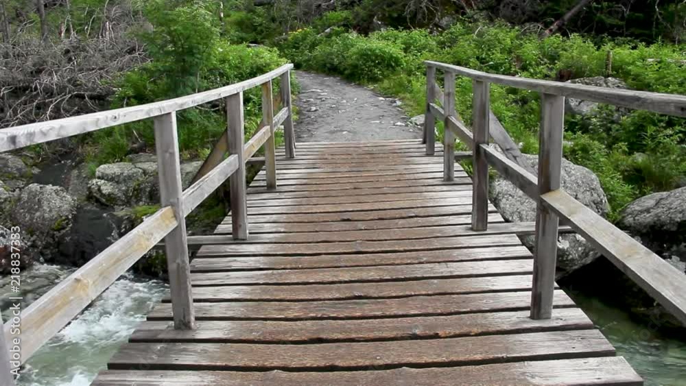 Wooden Bridge over Mountain River Wooden Bridge over Mountain River