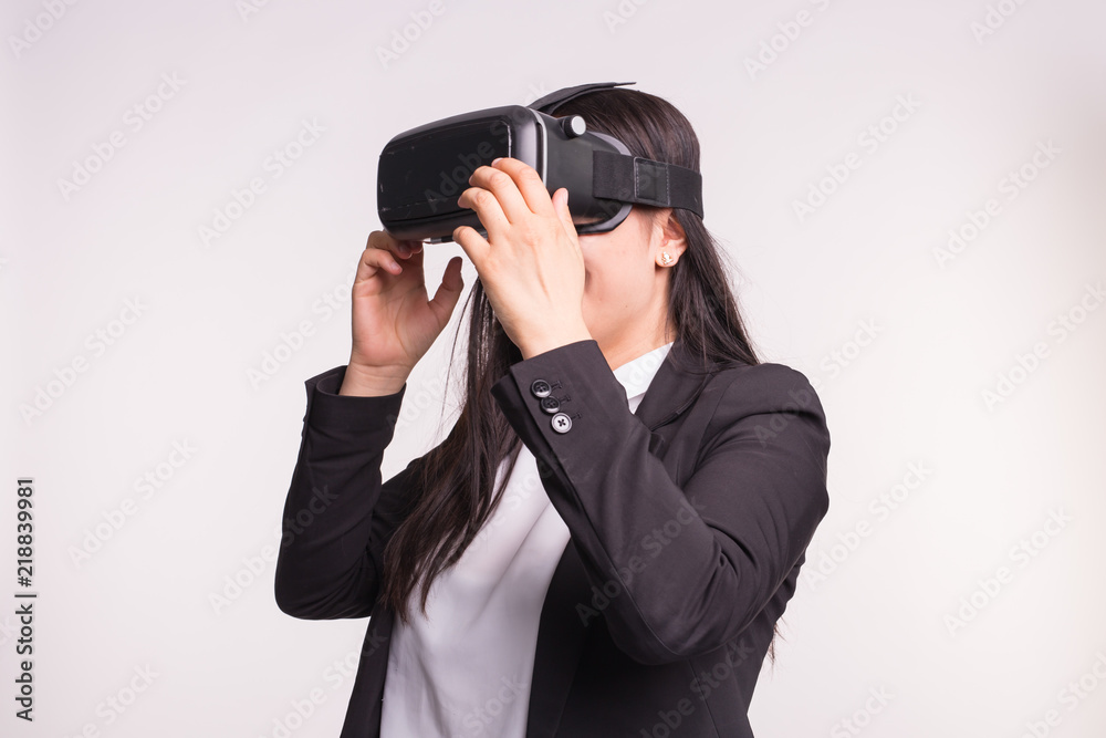 Young woman with virtual reality helmet on white background Young woman with virtual reality helmet on white background