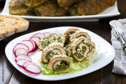 pork roulades stuffed with spinach sprinkled with freshly grated horseradish