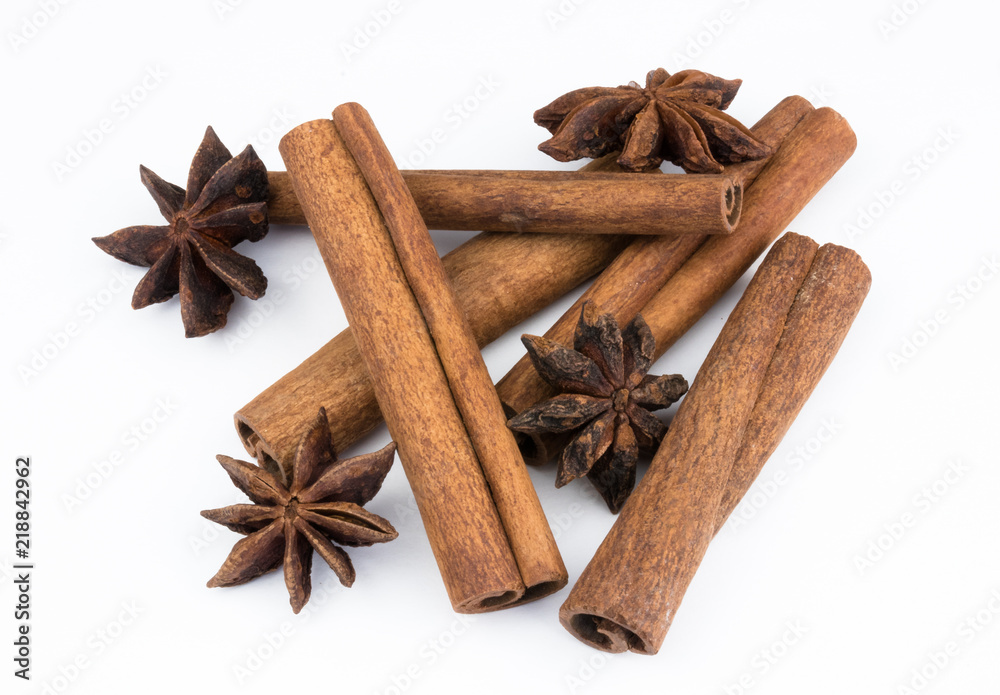 cinnamon sticks and anise spice star, isolated on white background close-up. fragrant spices. cinnamon sticks and anise spice star, isolated on white background close-up. fragrant spices.
