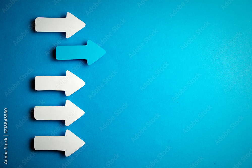 white arrows on a blue background. leadership purposefulness self-development concept