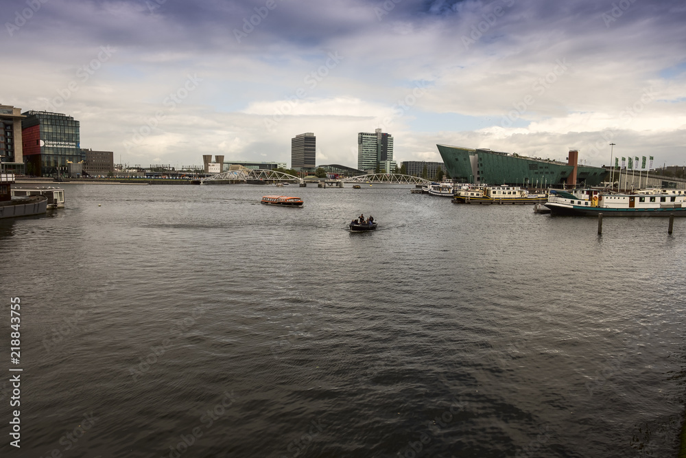 Amsterdam Oosterdok. Harbour near Amsterdam Centraal Station and NEMO Science Museum Amsterdam Oosterdok. Harbour near Amsterdam Centraal Station and NEMO Science Museum