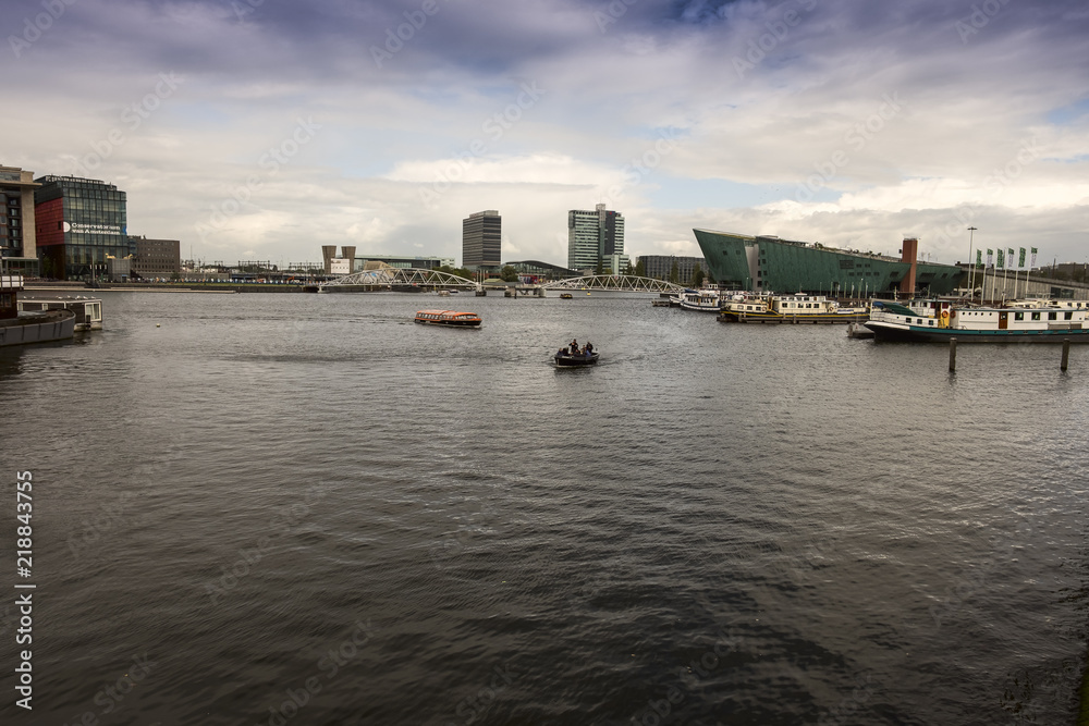 Amsterdam Oosterdok. Harbour near Amsterdam Centraal Station and NEMO Science Museum