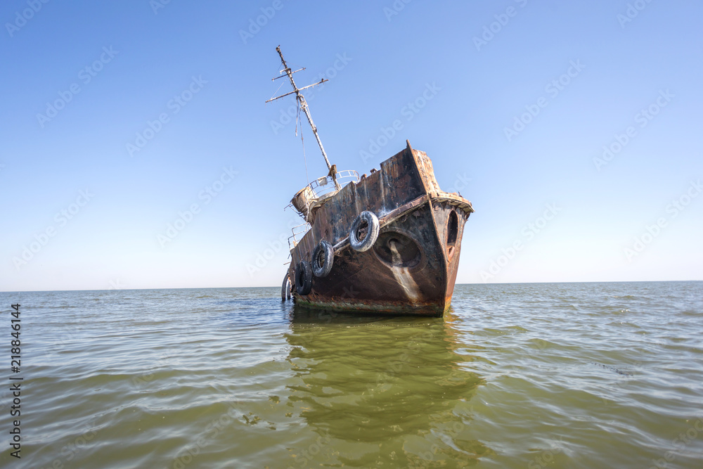 Abandoned Tuzla tug boat shipwreck in Sacalin peninsula in Danube Delta, Romania