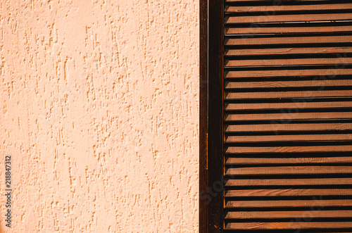 Wooden and concrete texture. Screen made of grating. Background, copy space