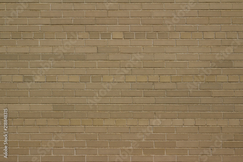 Vintage gray brick wall background in American bond pattern with a weathered grunge look