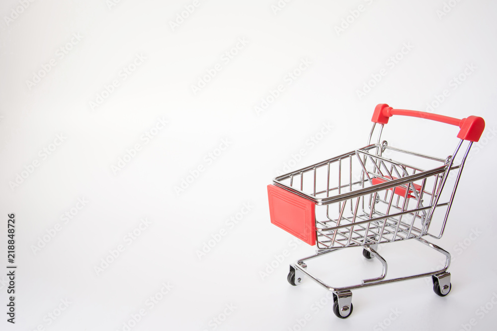 Red Shopping cart or supermarket cart on white background with copy space Red Shopping cart or supermarket cart on white background with copy space