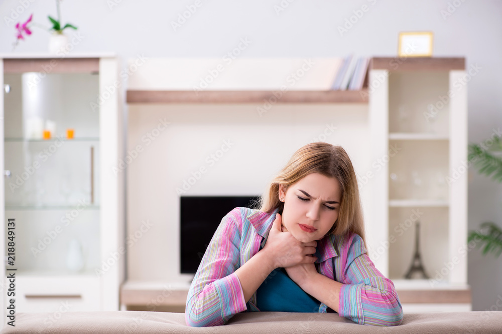 Young woman suffering from sore throat pain Young woman suffering from sore throat pain