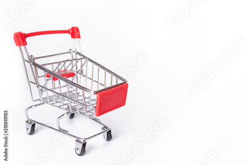 Red Shopping cart or supermarket cart on white background with copy space © Achira22