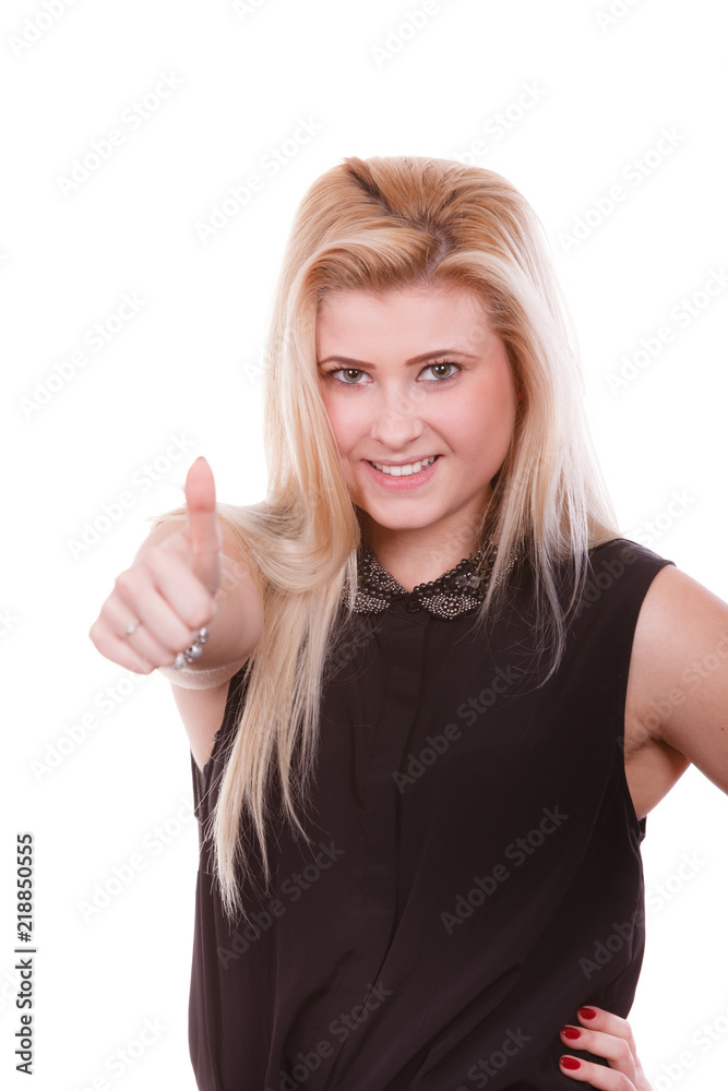 Smiling blonde woman making thumb up gesture Smiling blonde woman making thumb up gesture