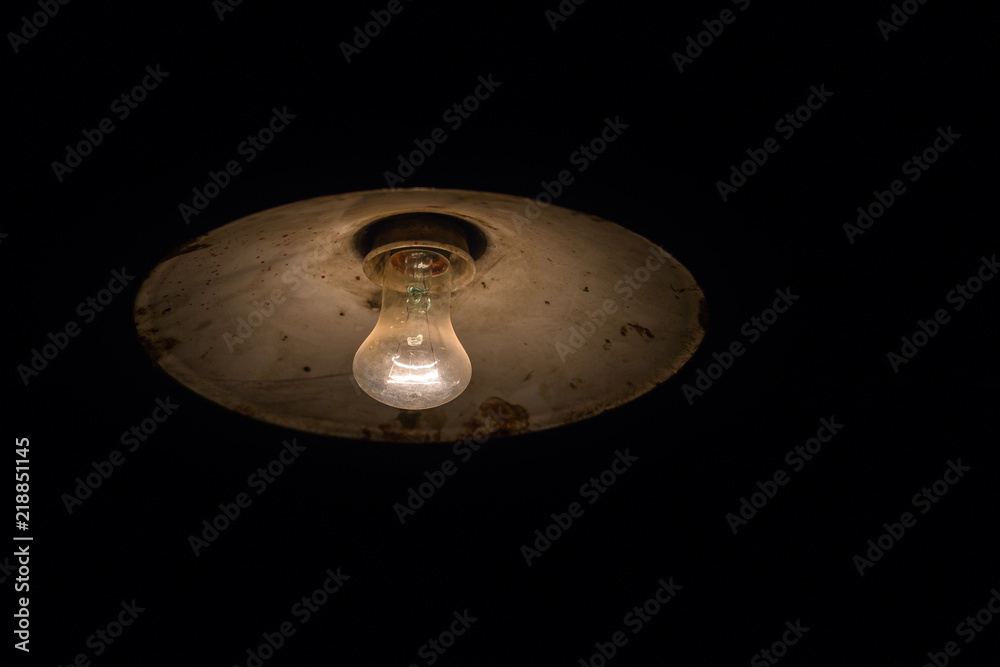 Old rusty ceiling lamp in comlpete darkness Old rusty ceiling lamp in comlpete darkness