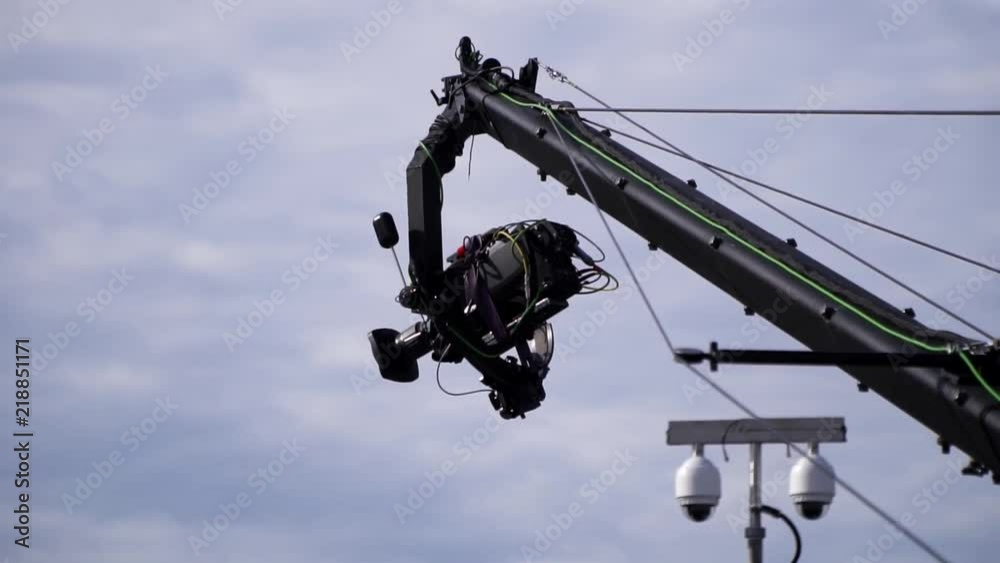 Broadcast TV camera on a moving jimmy jib crane arm, next to surveillance cctv cameras at a outdoor event
(slow motion) Broadcast TV camera on a moving jimmy jib crane arm, next to surveillance cctv cameras at a outdoor event
(slow motion)