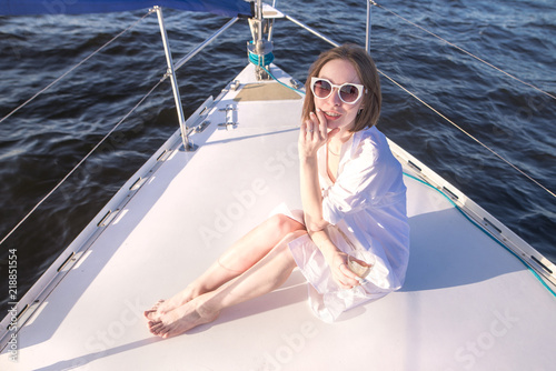 Blue sky and sail yacht look from the bottom. Yachting concept. Background. Walk on a sailing yacht by sea.